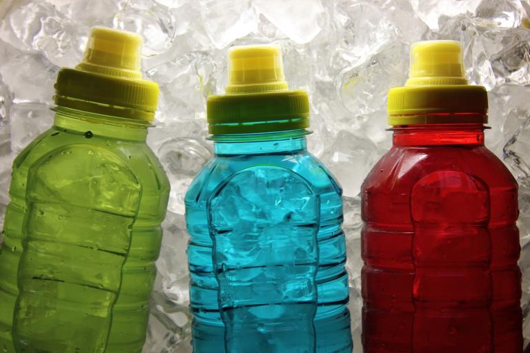 sport bottles with colored liquid inside them